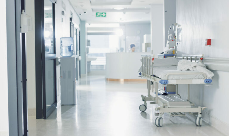 Hospital, healthcare and medical with an empty corridor for wellness, care or treatment and disease control. Medicine, service and hallway of a lobby in a clinic for rehabilitation or recovery