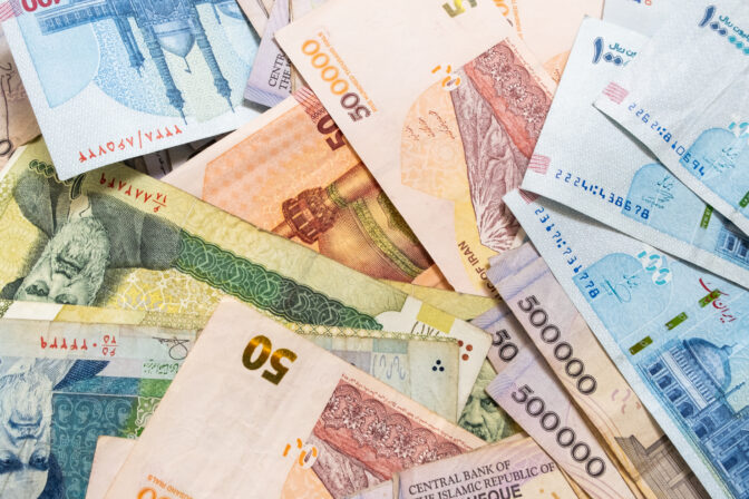 Background from different Iranian Rial or IRR banknotes from Iran.