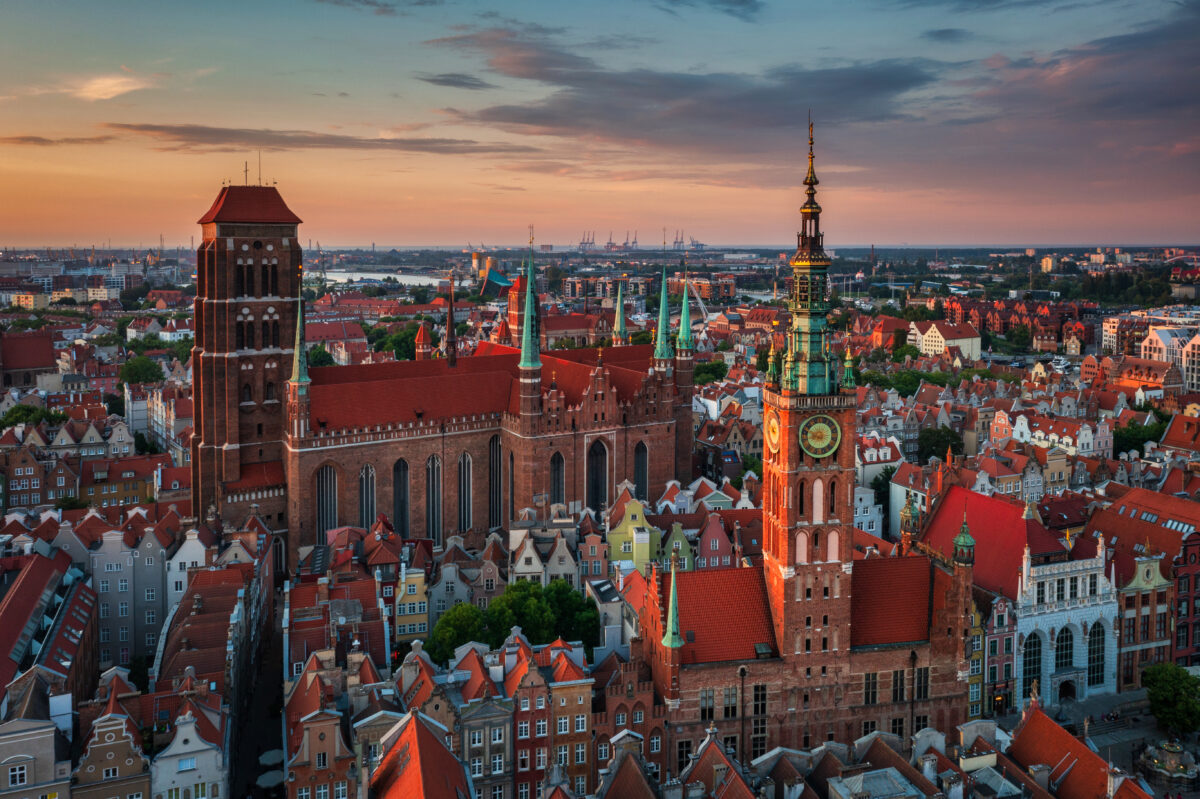 Main City Hall and the St. Mary Basilica in Gdansk at sunset, Poland