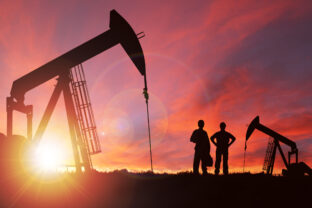 Sunset Over Pumpjack Silhouette With Copy Space