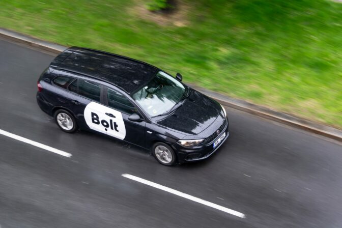 Black Fiat Tipo Combi (Type 356) estate car  of Bolt company with motion blur effect