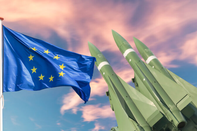 The Europian Union flag in front of tactical missile weapons
