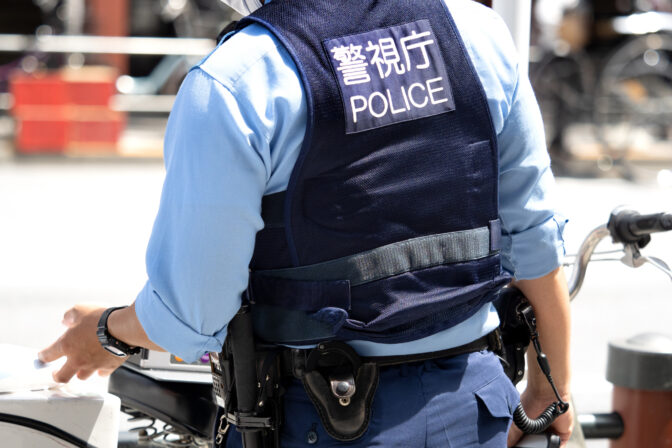 A police officer standing in the city