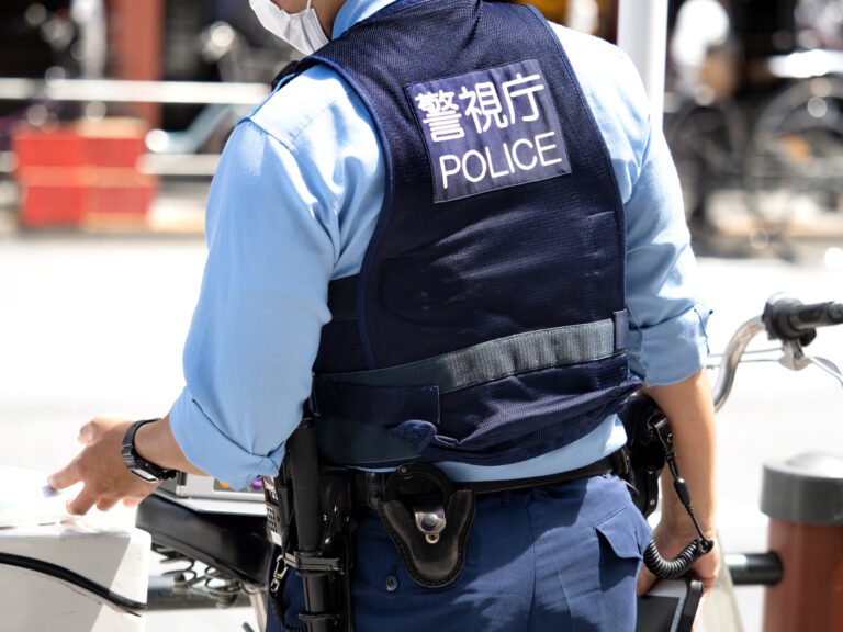 A police officer standing in the city