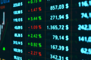 Business and stock exchange data on the screen.