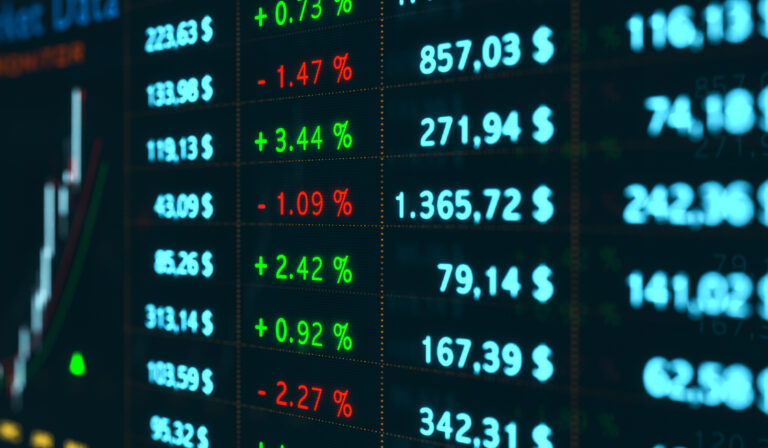 Business and stock exchange data on the screen.