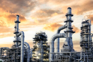 Oil and Gas Industrial zone,The equipment of oil refining,Close up of industrial pipelines of an oil refinery plant,Detail of oil pipeline with valves in large oil refinery.
