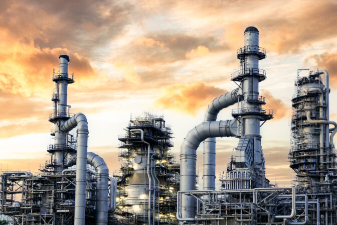 Oil and Gas Industrial zone,The equipment of oil refining,Close up of industrial pipelines of an oil refinery plant,Detail of oil pipeline with valves in large oil refinery.