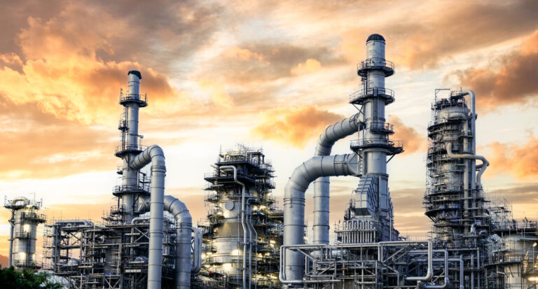 Oil and Gas Industrial zone,The equipment of oil refining,Close up of industrial pipelines of an oil refinery plant,Detail of oil pipeline with valves in large oil refinery.