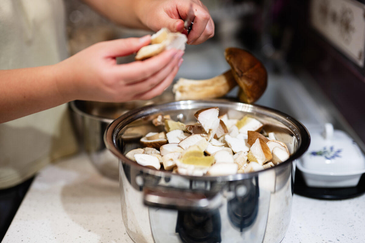 Preparing fresh mushrooms in a modern kitchen cooking environment