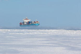 Container ship on icy waters