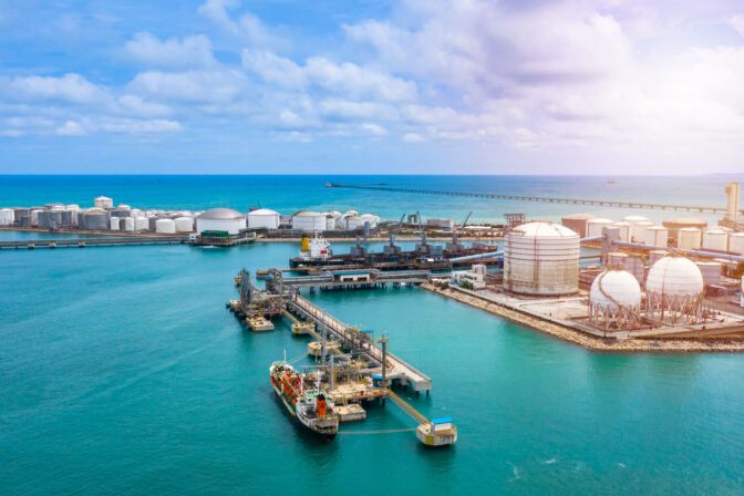 Aerial view white storage tank of oil and gas and petrochemical products ready for logistic and transport business.