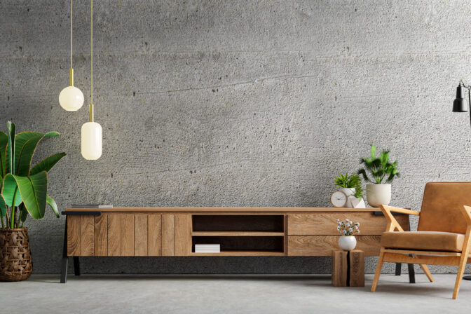 Living room interior have cabinet for tv and leather armchair in cement room with concrete wall.