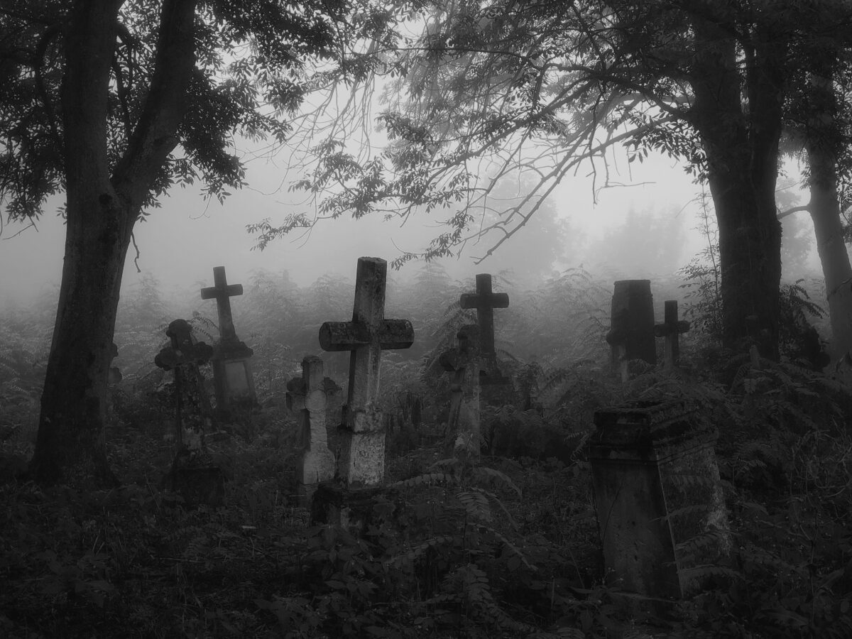 Crosses and graves in the old abandoned cemetery.