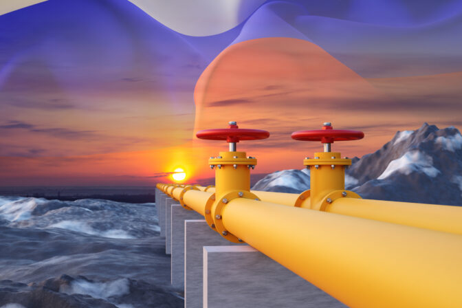 Pipeline with Russian Federation flag against the sunset. Import of gas from Russian federation