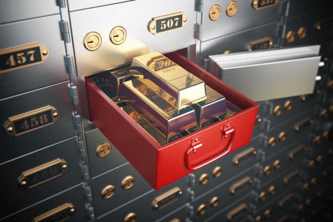 Safe deposit box with golden ingots. Financial banking investment concept.