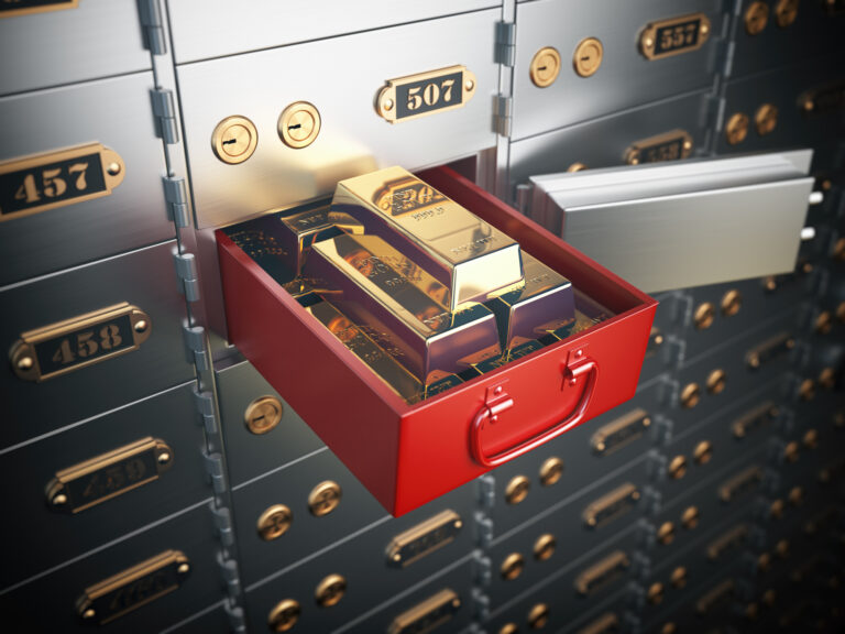 Safe deposit box with golden ingots. Financial banking investment concept.