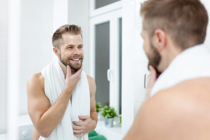 Morning hygiene, Man in the bathroom looking in mirror