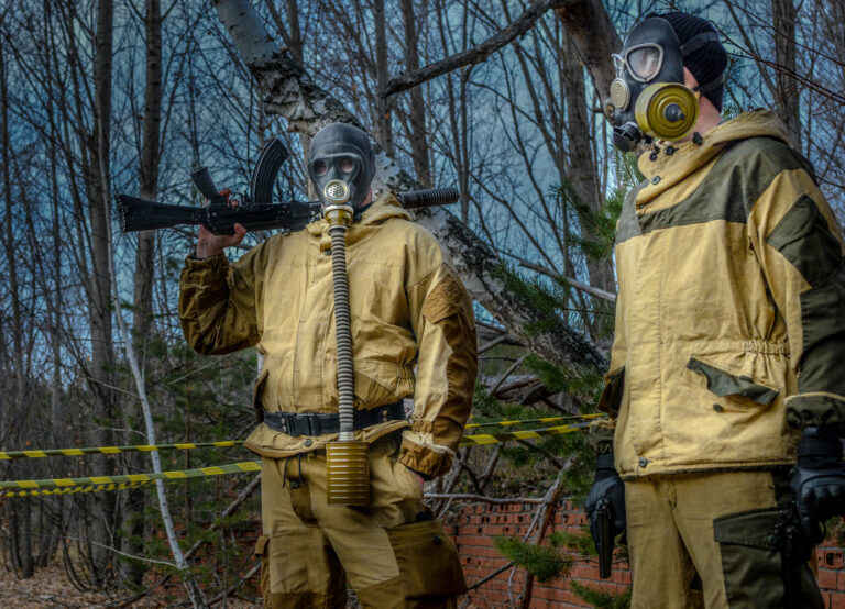 An armed stalker in overalls and a gas mask in a dangerous radioactive zone.