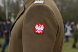 The emblem of Poland on the uniform of a soldier of the Polish army.