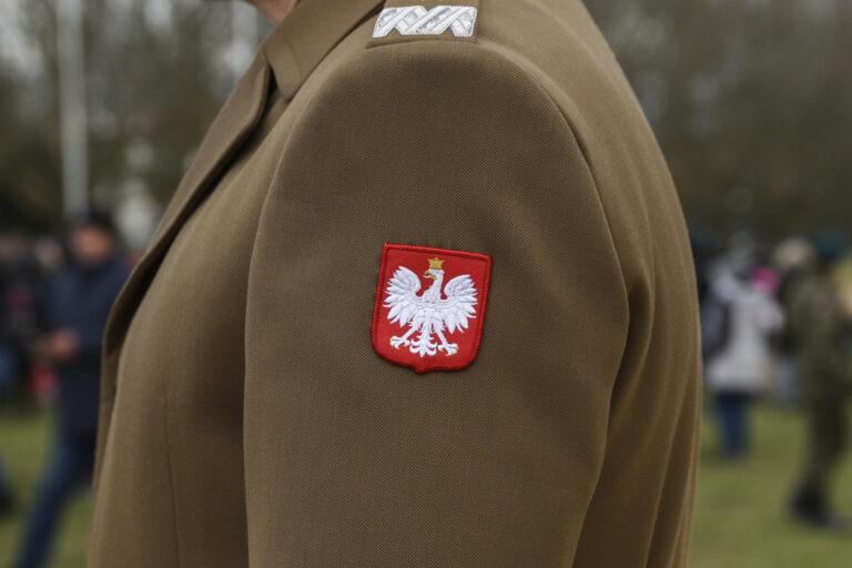 The emblem of Poland on the uniform of a soldier of the Polish army.