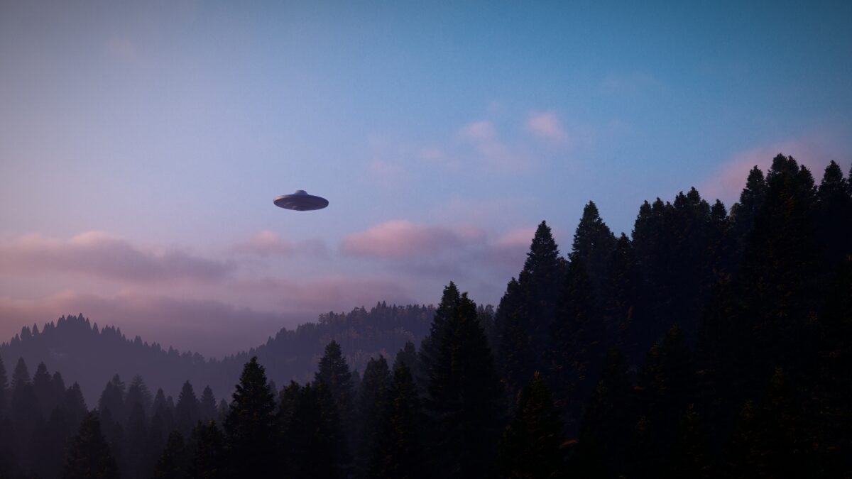 3D illustration. UFO over the mountains
