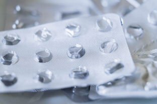 Background of used medicine packages. Empty plastic blister package