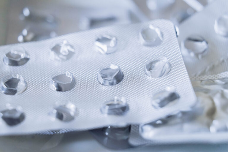 Background of used medicine packages. Empty plastic blister package