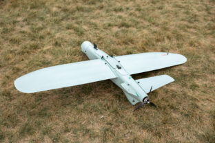A Ukrainian made Leleka reconnaissance drone lies on the grass