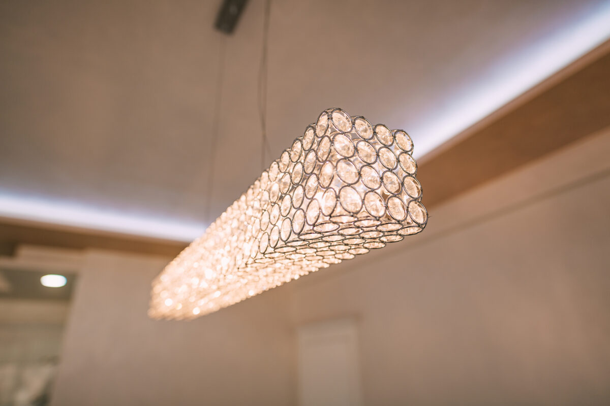 Chandelier in the apartment. A beautiful chandelier on the ceili