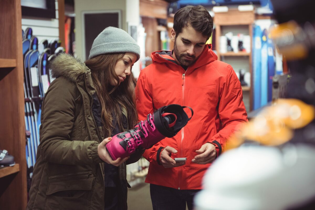 Couple selecting shoe together in a shop