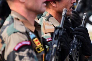 Armed forces marching with gun