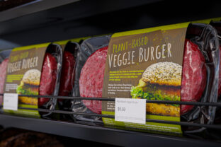 Vegan burger vacuum packed on a store shelf - 3d illustration