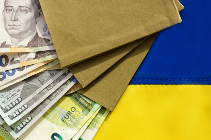 Currency in convet on the Ukrainian flag. Dollars, euros and hryvnias.