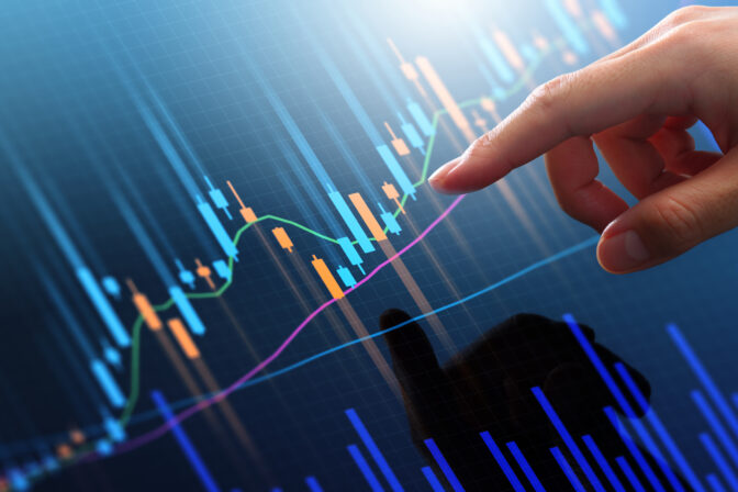 Stock market trading chart and analyzing investment opportunity.