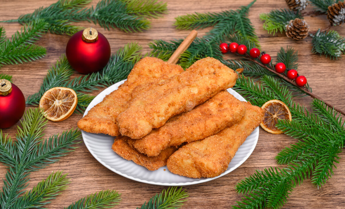 A plate of breaded fish for the holidays lying on the Christmas Eve table