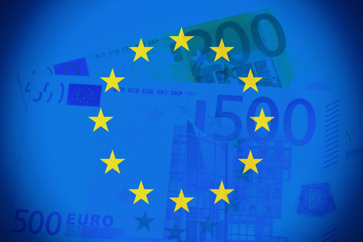 European Union flag and euro cash bills