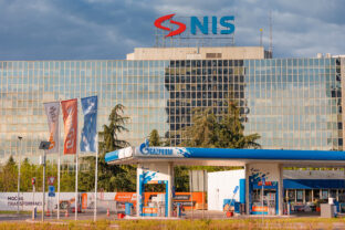 NIS headquarters with Gazprom gas station, energy industry tied to Russia and sanctions context