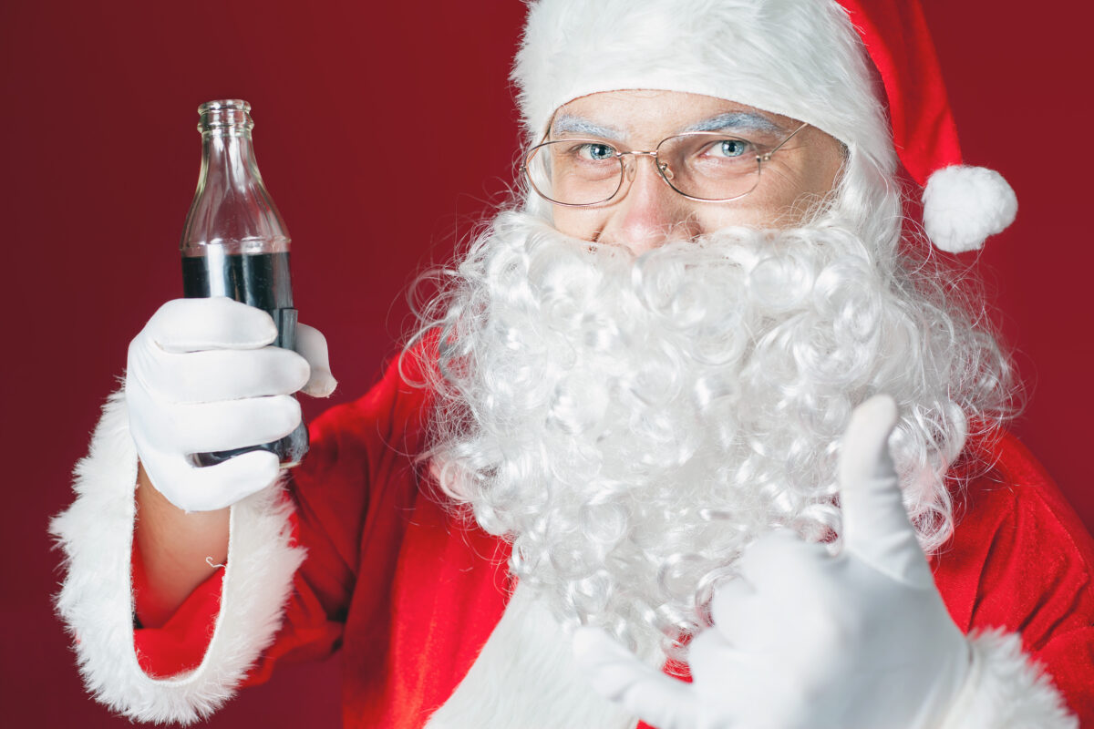 Santa Claus holding Coca Cola fresh beverage, Christmas holiday