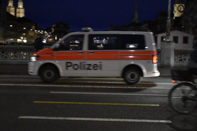 Switzerland Police Officer With Land Vehicle On The Road, Zurich, Switzerland, Night