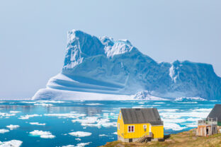 Picturesque village on coast of Greenland - Colorful houses in Tasiilaq, East Greenland