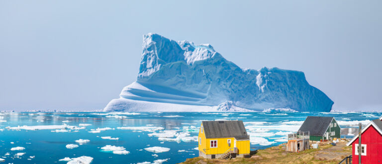 Picturesque village on coast of Greenland - Colorful houses in Tasiilaq, East Greenland