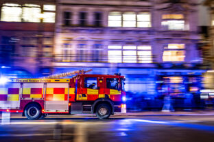 London Fire Department engine responding to emergency. Motion Panning effect stock photo