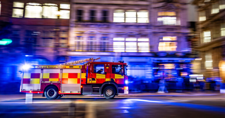 London Fire Department engine responding to emergency. Motion Panning effect stock photo