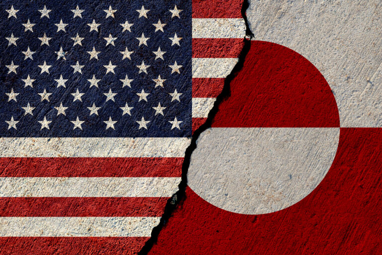 Usa and greenland flags painted on concrete wall