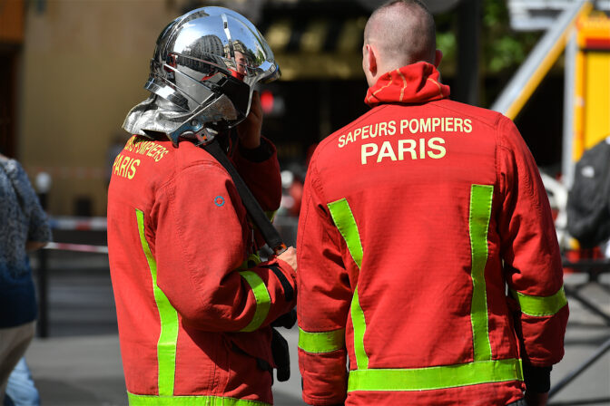 Firefighters on  a street in Paris, France.