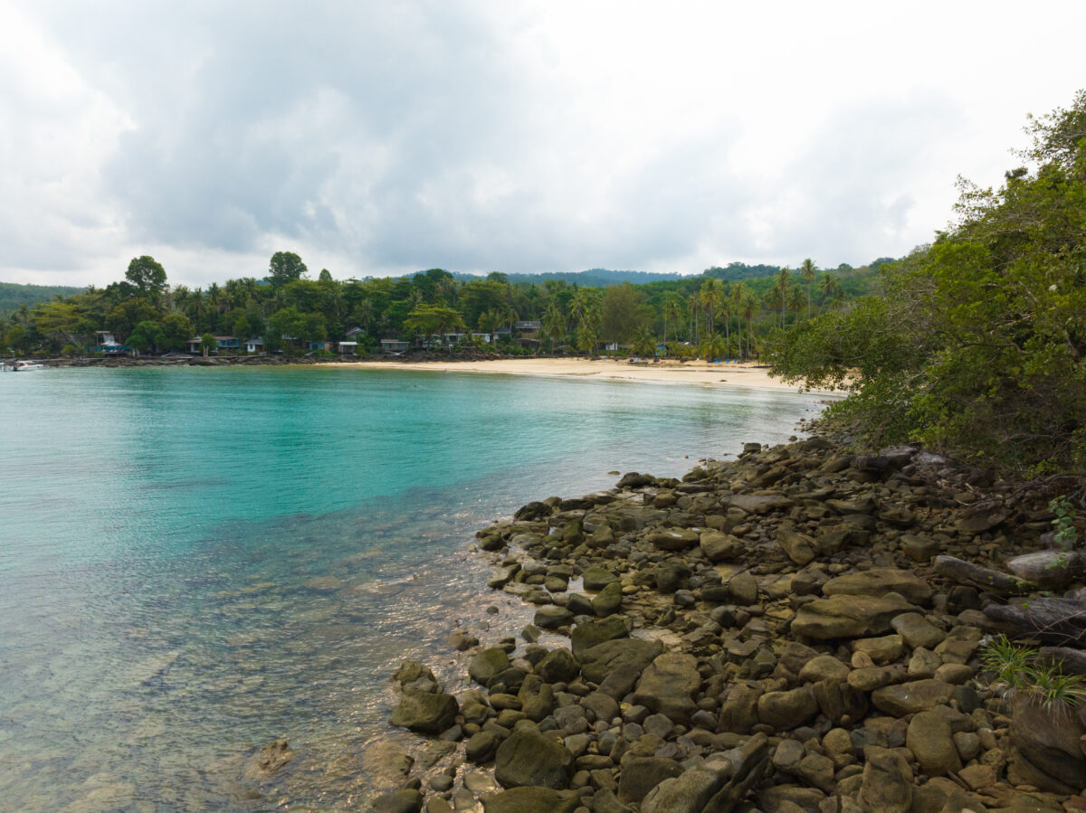 Aerial drone view of beautiful beach with turquoise sea water and palm trees of Gulf of Thailand. Kood island, Thailand