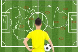 Soccer player holding a ball and thinking attack tactics