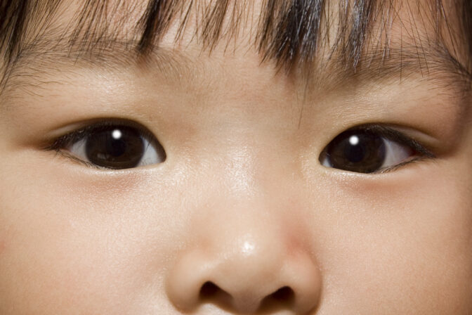 Young Asian child's inquisitive eyes