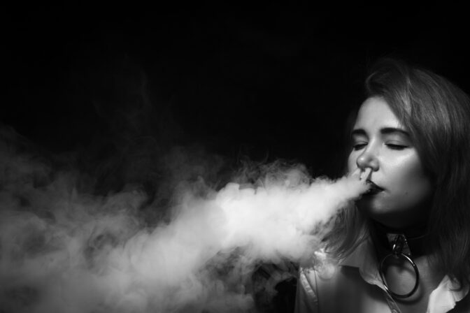 Smart student blonde girl vaping